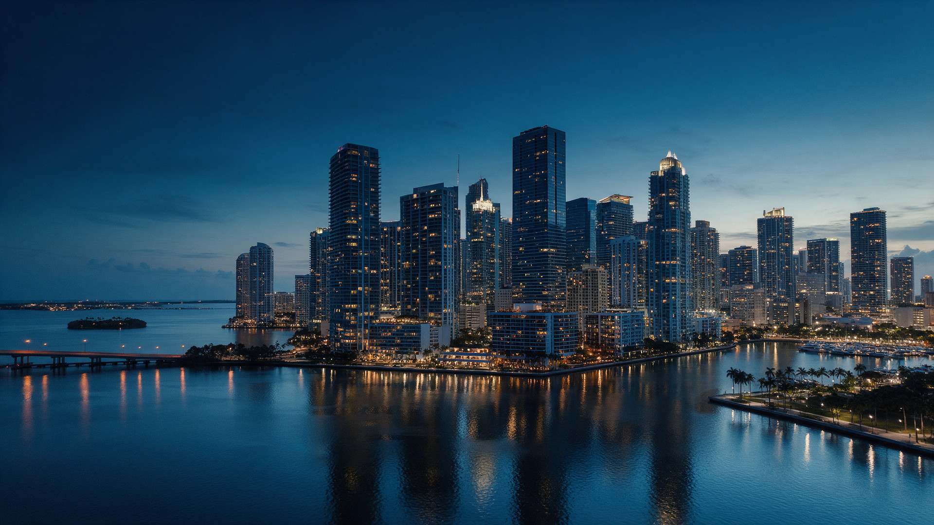 Vista aerea do skyline de Brickell e do centro de Miami ao anoitecer, onde a Grenty opera nos Estados Unidos